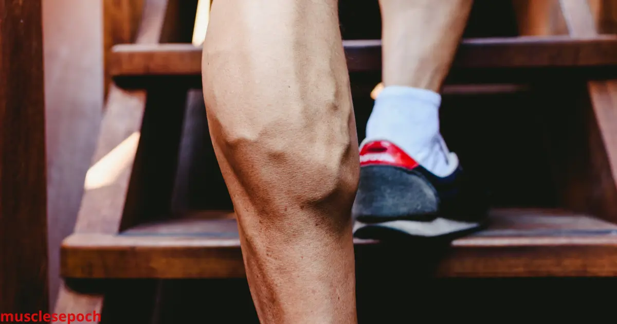Bodybuilder performing standing calf raises with heavy dumbbells in a gym, highlighting calf muscle engagement.