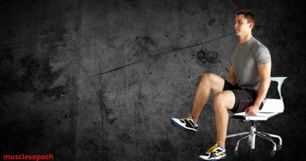 Person performing seated knee raises on a bench, lifting knees toward the chest to engage the lower abdominal muscles.