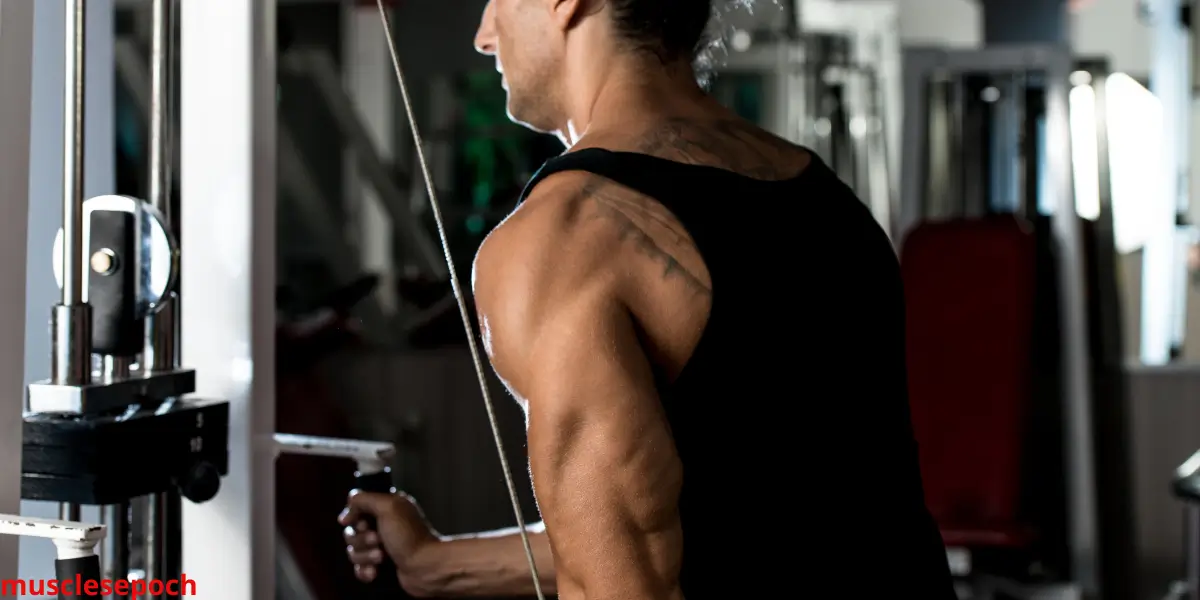 Beginner performing triceps kickbacks with dumbbells in a home workout setting.