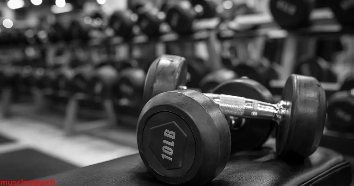 Man performing a dumbbell workout at home, showcasing a beginner-friendly full-body routine using minimal equipment.