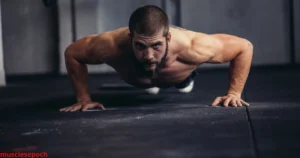 Man performing push day exercises targeting chest, shoulders, and triceps in a gym.