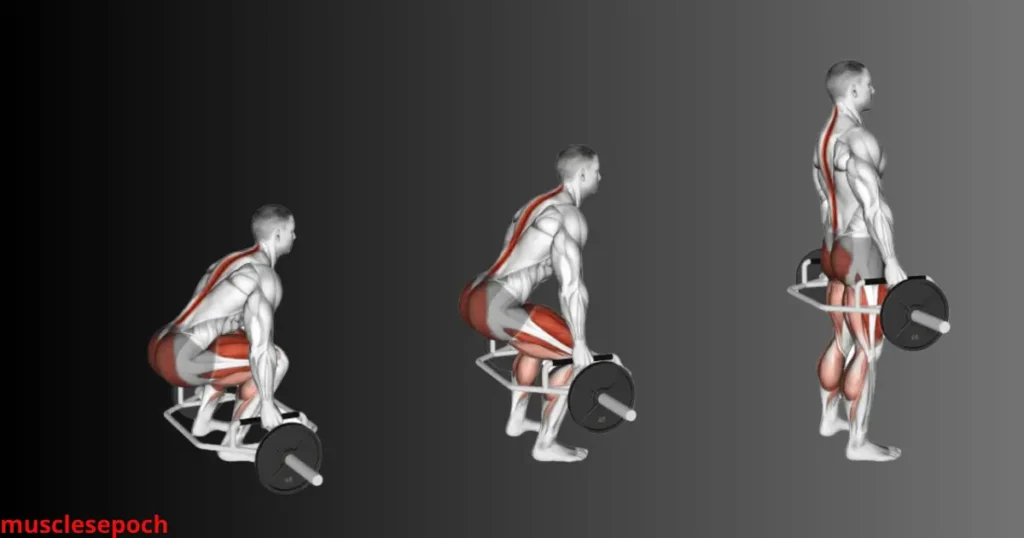 Lifter demonstrating proper trap bar deadlift form with a flat back, neutral spine, and engaged core in a gym environment.